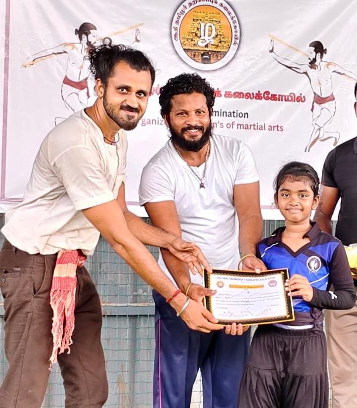 Certification ceremony in front of the Tamizhar Kalai Puducherry banner